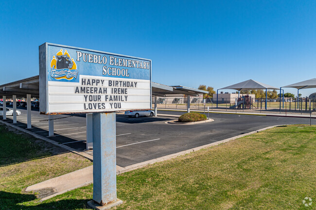 Pueblo Elementary School in Yuma has a welcoming entrance with a sign displaying the school’s name.