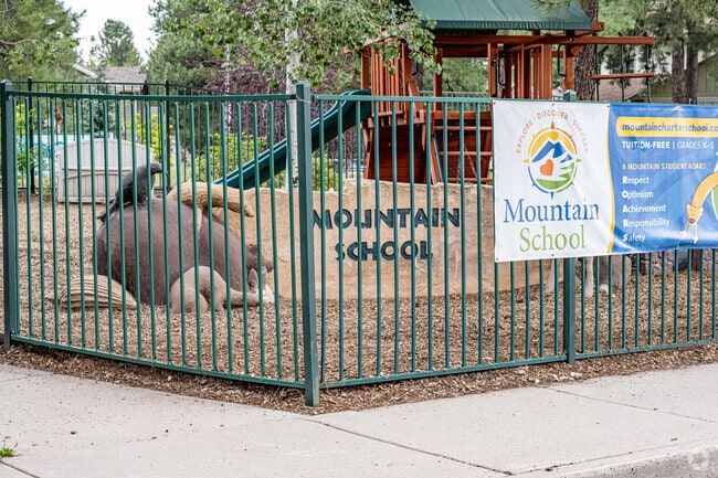 Mountain School students enjoy fresh air from the surrounding trees.