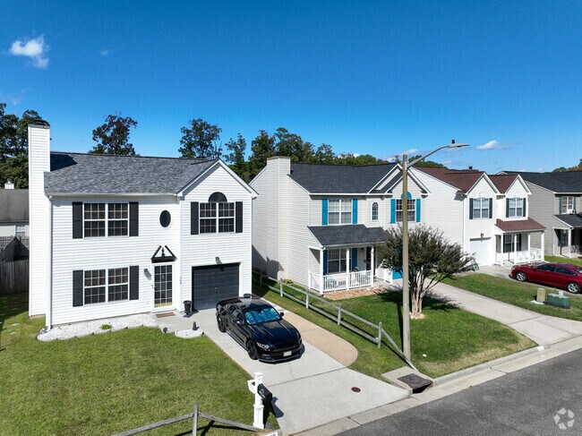 A row of larger homes in McIntosh, Newport News, shines in the Virginia sun.