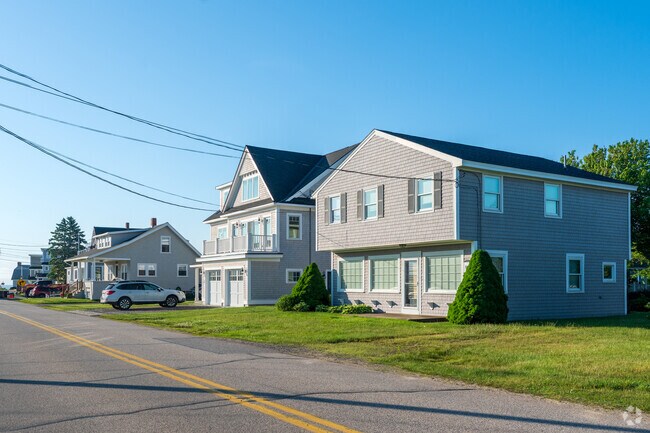Row of homes take part in Cape Neddick's landscape.
