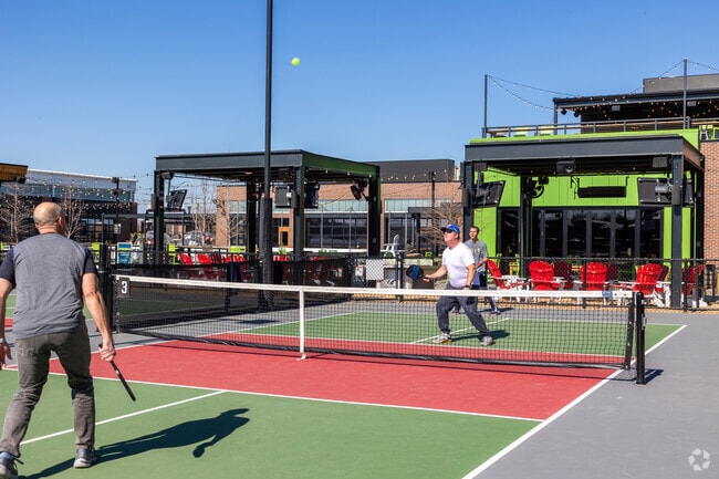 Central Overland Park residents head to Chicken N Pickle for pickleball and food.