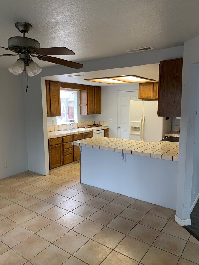 Kitchen has new GE Stove and Microwave, & fan