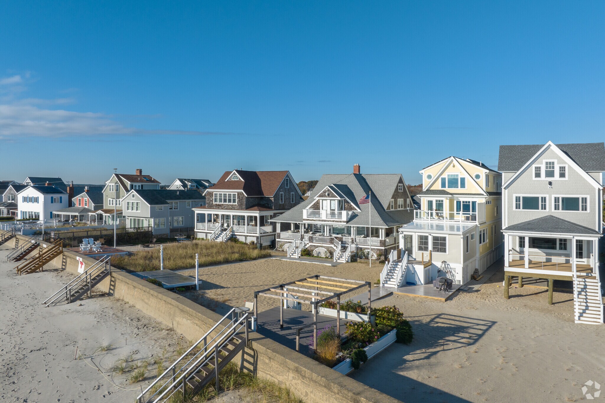 A row of east-facing homes soak up the morning sun in the Green Harbor.