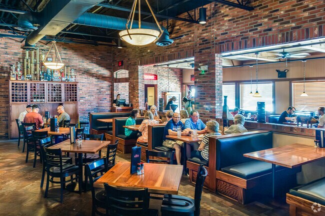 Spitfire Bar & Grill near Tintes serves smoked meats and cold beers.