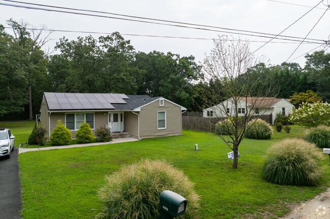 Single-story residence in Elwood’s pine barrens, featuring modern upgrades and proximity to Cedar Creek High School.