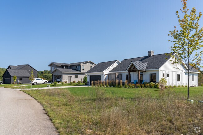Modern Ranch homes on well-manicured lots stand out in Maple City.