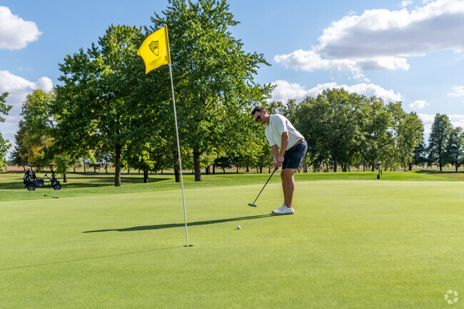 A golfer hits a putt at one of the holes at the Sunnyside Golf and Country Club.