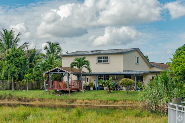 Some Spring Tree single family homes have canal views with wooden decks.