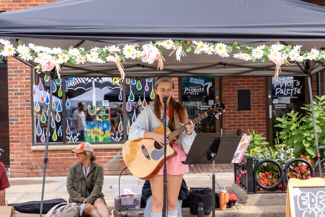 Visitors enjoy live music from local artists at the Appleton Farmer's Market.