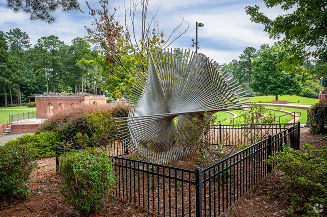Unique art installations line the 1-mile shaded walking path behind the courthouse in Evans.