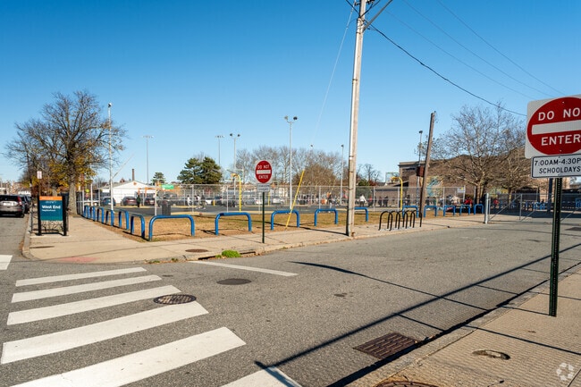 Kids playing at the basketball court at the Alfred Lima Elementary School in Providence.