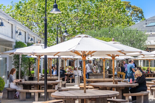 A large outdoor seating area is centrally located at Marin County Mart.