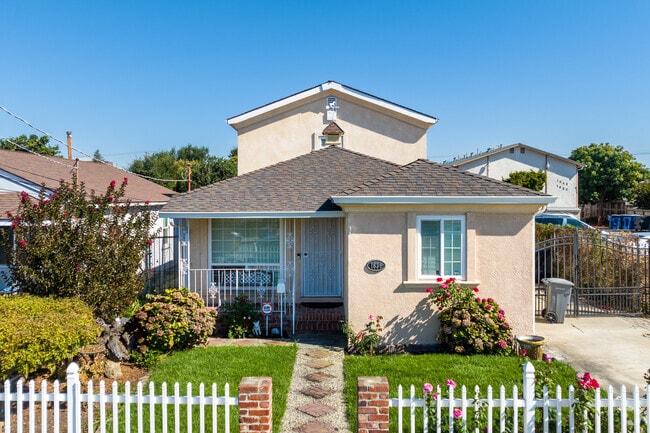 Green, neatly manicured lawns line the streets of the Davis Tract neighborhood.