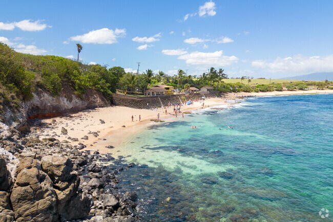 Ho‘okipa Beach Park, located just west of Haiku, is renowned for its consistent surf breaks like Pavilions and Middles, making it a favorite among both surfers and spectators.