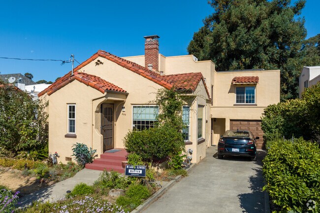 A Mediterranean-styles home sits next to a lush area in Estudillo Estates-Glen.