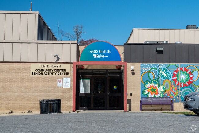The colorful entrance to a community center in Coral Hills welcomes residents for gatherings and local events.