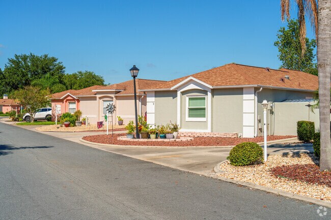 This row of homes in the Village of Palo Alto showcases beautiful rock landscaping and character