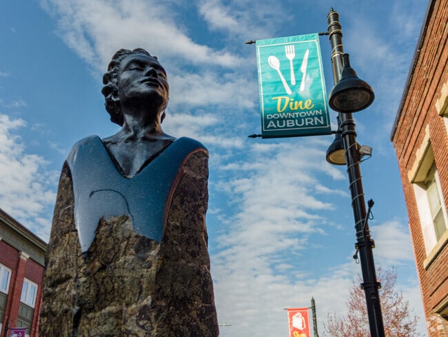 The Silent Words sculpture in Downtown Auburn glistens in the sun.