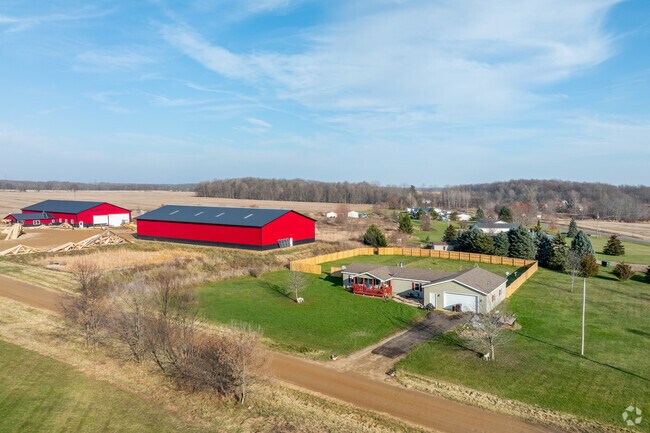 A house next to a commercial business in the village of Vermontville.