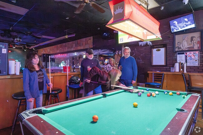 Enjoy a billiards game every night at Uncle Mick's Bar & Grill near The Shores.