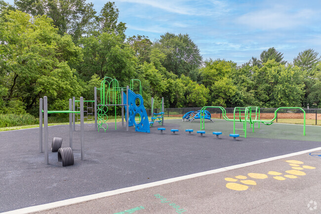 The Freehold Learning Center has a playground in a park like setting.