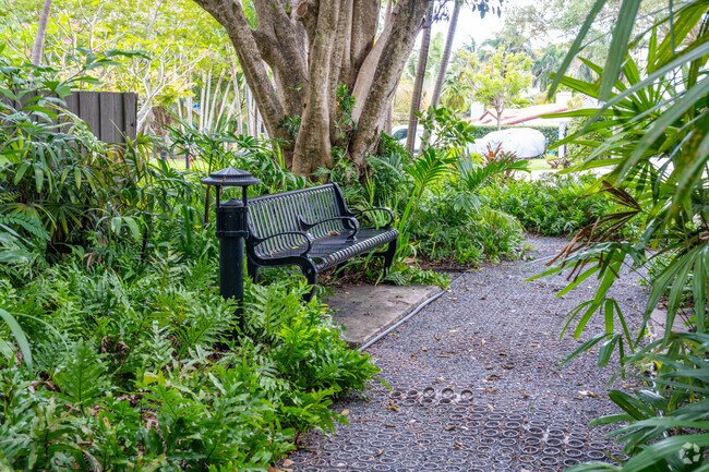 A bench provides a place to relax off the path in Sherwood Forest Park.