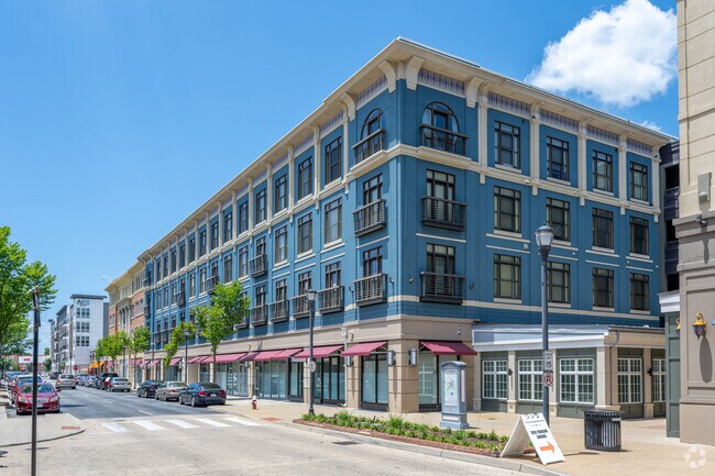 Apartment complexes perch above retail storefronts in central Coliseum Central.