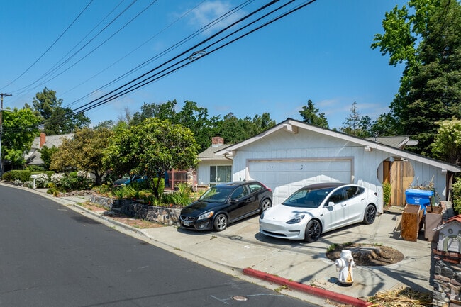 A quiet street and lush trees surround this welcoming Palos Verde Area residence.