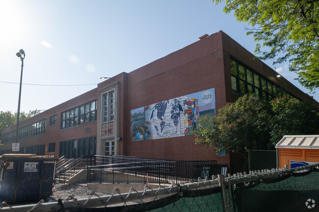 Murals are depicted along the Mayer Elementary School building in Sheffield and DePaul.