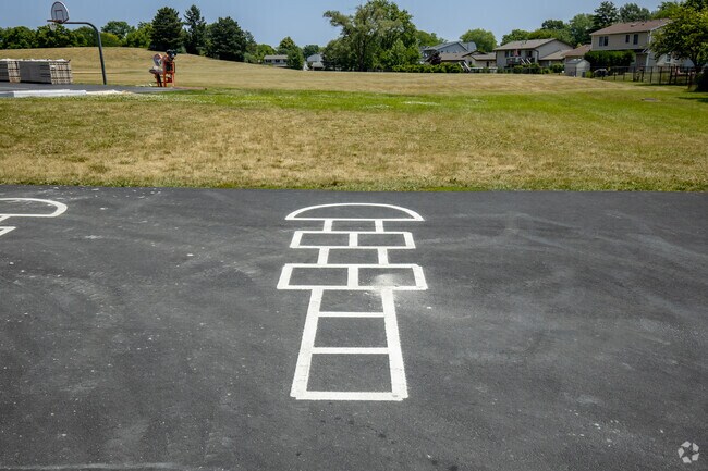 Permanently painted hopscotch on asphalt for students to play on at Admiral Byrd Elementary.