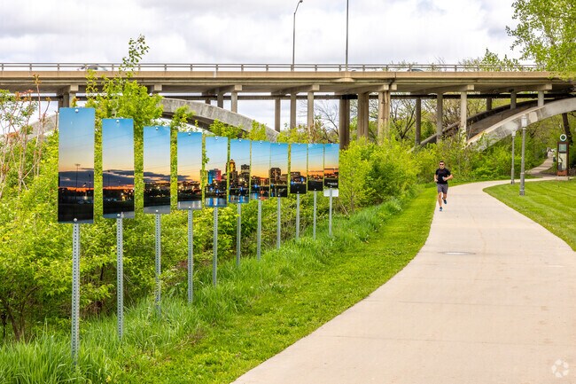 Art installations near the Botanical Gardens greet joggers and bikers on the riverfront trail.