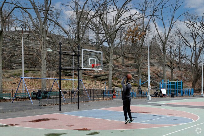 Local Astor Row resident enjoying a beautiful day in Marcus Garvey Park.