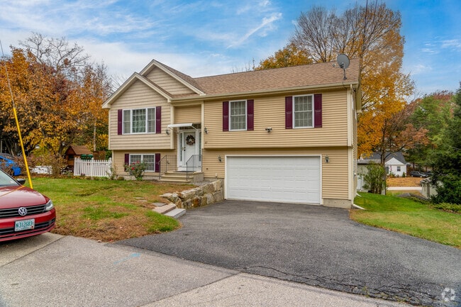 A new traditional style home in Wolfe Park has an attached lower level garage.