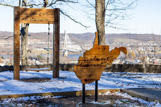 Take a selfie on the Almost Heaven swing overlooking the city near Walnut Hills