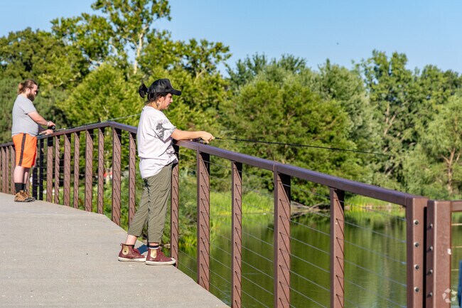 Locals enjoy fishing at Holmes Lake Park.