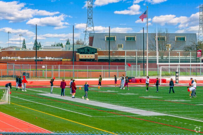Students of Woodcreek High School exercise outside for physical education in Woodcreek Oaks.