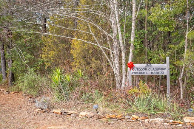 The students of Jefferson Middle School enjoy outdoor classes in the adjoining woods.