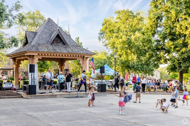 Dance under the blue skies: Families grove at Concert in the Park in St. Charles.