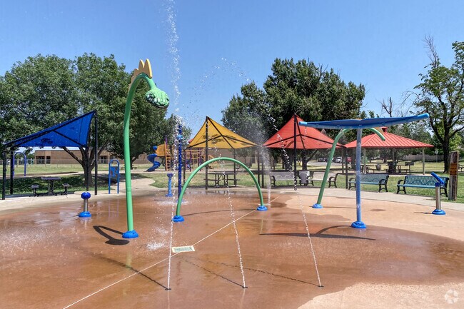 Children love to cool off in the summer at the splash pad at Harvest Hills Park.