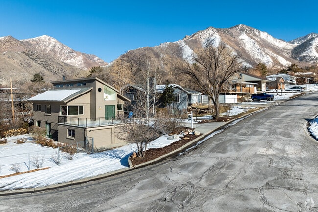 Mature trees line quiet Millcreek streets along the Wasatch foothills.