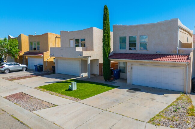 Homes with southwestern stucco exteriors pair with gravel yards and desert shrubs.