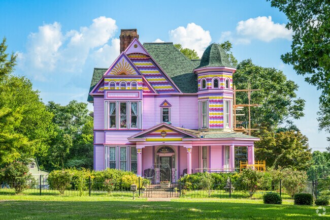 A Victorian home with wrought-iron fencing adds color to Historic Downtown Anniston.