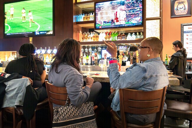 Gathering at BJ's Restaurant, friends in Shadow Creek Ranch enjoy catching up over drinks.