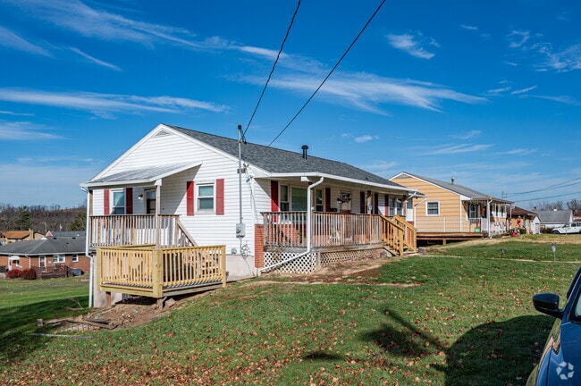 A row of ranch-style homes lines a street in Masontown, Pennsylvania.