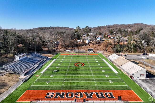 The Clinton High School Dragons play on a turf football field in downtown Clinton.