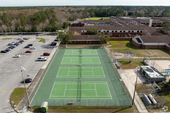 Mandarin High School students enjoy tennis on the available four courts.