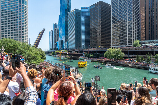 Thousands flock to the river for the annual Chicago Ducky Derby in Streeterville.