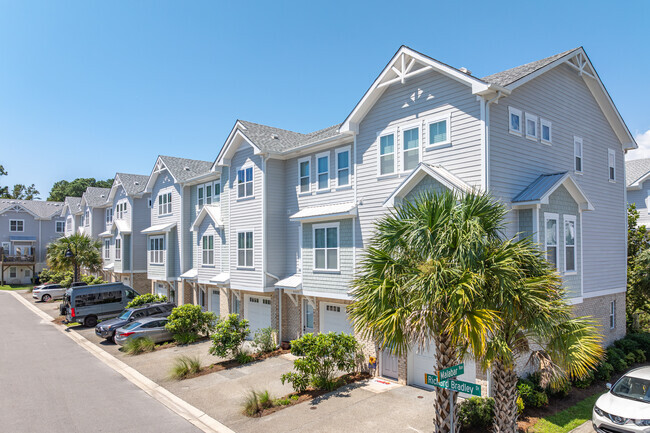 Three-story townhomes in Seagate South feature first-floor garages.