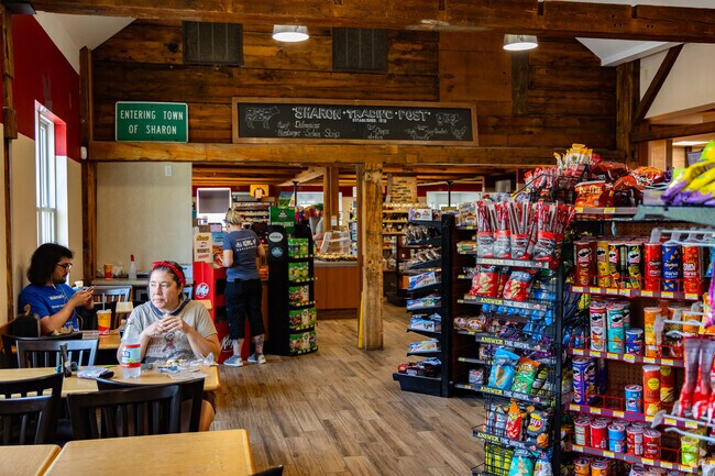Locals stop by Sharon Trading Post for snacks, essentials, and neighborly conversation.