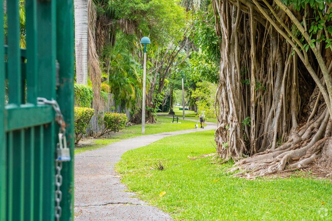 Person Walking Their Dog on an El Portal Residential Street Sidewalk.